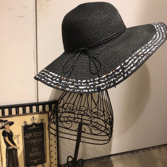 Accessories - Wide brimmed sun hat. Trimmed four layers of black white and browns. Hardly worn